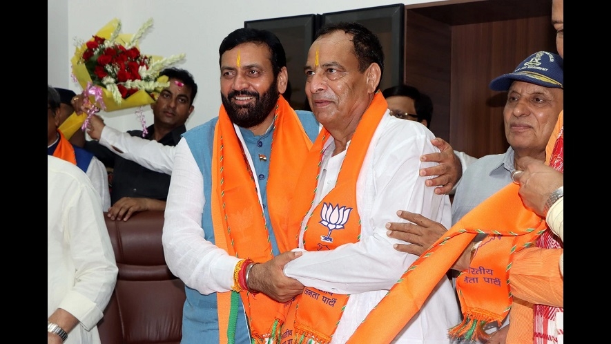 Haryana Chief Minister Nayab Singh being greeted by Haryana BJP chief Mohan Lal 