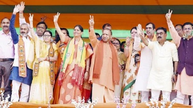 Uttar Pradesh Chief Minister Yogi Adityanath with other BJP leaders during a public meeting