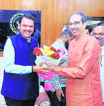 Uddhav Thackeray greeting Chief Minister Devendra Fadnavis