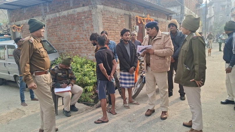 Policemen taking statements of the residents near