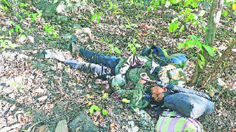 Body of slain insurgent lying in jungle post 